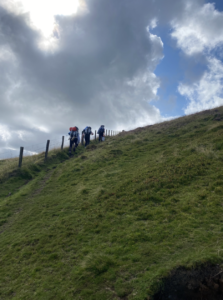 Team KHS clamber up a hill on the Duke of Edinburgh Expedition