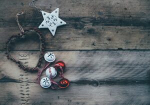 A Christmas decoration with a star, and bells. Photo by Annie Spratt on Unsplash