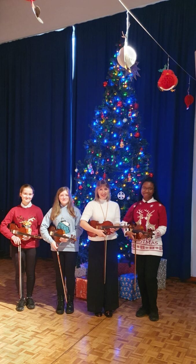 Christmassy musicians at the 2024 Christmas assembly