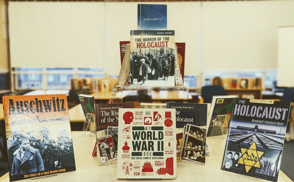 Photo of a library display featuring non-fiction books about the Holocaust.