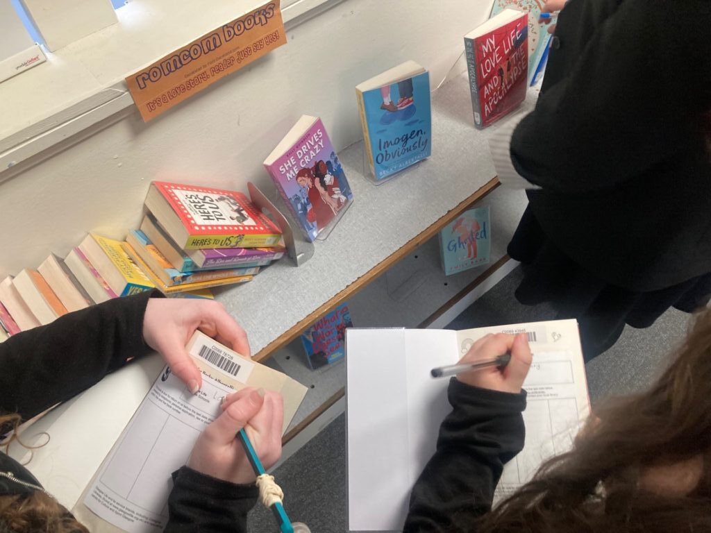 pupils writing the book genre inside the book
