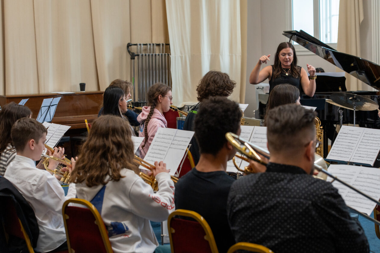 Young jazz musicians exploring groove and improvisation during the workshop.