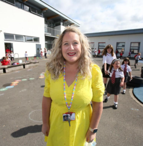 Mrs O'Hagan smiling in the playground.